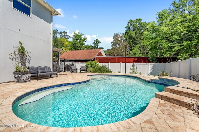11725 Paddock Gates Dr, Jacksonville, FL 32223 - view of swimming pool with a patio, a fenced backyard, and an outdoor hangout area