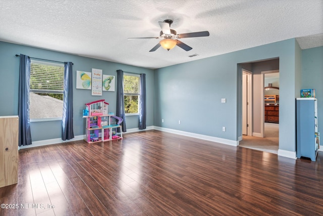 11725 Paddock Gates Dr, Jacksonville, FL 32223 - playroom featuring ceiling fan, a textured ceiling, healthy amount of natural light, and wood finished floors