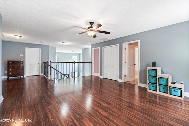 11725 Paddock Gates Dr, Jacksonville, FL 32223 - empty room featuring a ceiling fan, wood finished floors, baseboards, and a textured ceiling