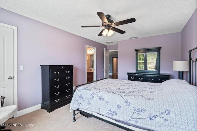 11725 Paddock Gates Dr, Jacksonville, FL 32223 - bedroom with light colored carpet, a textured ceiling, baseboards, ceiling fan, and ensuite bathroom