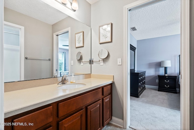 11725 Paddock Gates Dr, Jacksonville, FL 32223 - bathroom featuring vanity, a textured ceiling, and baseboards