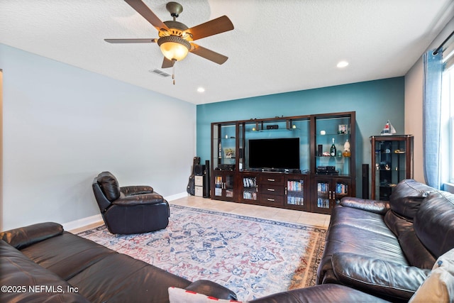 11725 Paddock Gates Dr, Jacksonville, FL 32223 - tiled living room featuring ceiling fan, baseboards, recessed lighting, and a textured ceiling