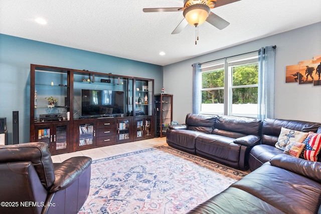 11725 Paddock Gates Dr, Jacksonville, FL 32223 - tiled living room featuring a ceiling fan, a textured ceiling, and recessed lighting