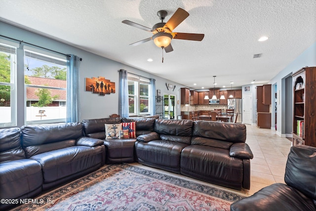 11725 Paddock Gates Dr, Jacksonville, FL 32223 - living room featuring ceiling fan, recessed lighting, light tile patterned flooring, and a textured ceiling