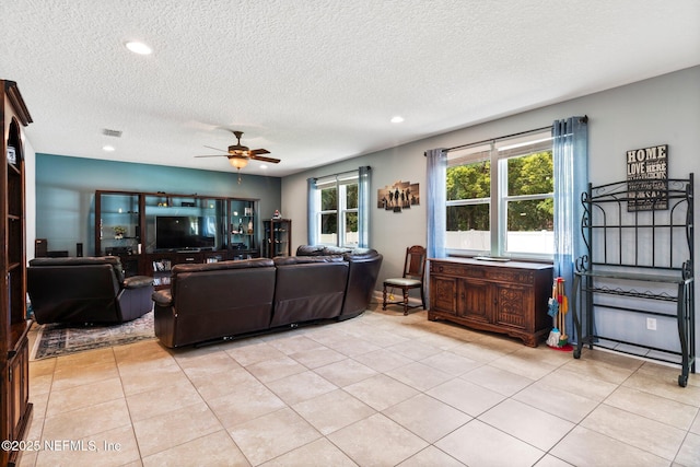 11725 Paddock Gates Dr, Jacksonville, FL 32223 - living area featuring a textured ceiling, ceiling fan, light tile patterned floors, and recessed lighting