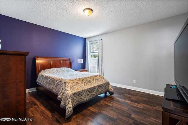 11725 Paddock Gates Dr, Jacksonville, FL 32223 - bedroom with wood finished floors, a textured ceiling, and baseboards