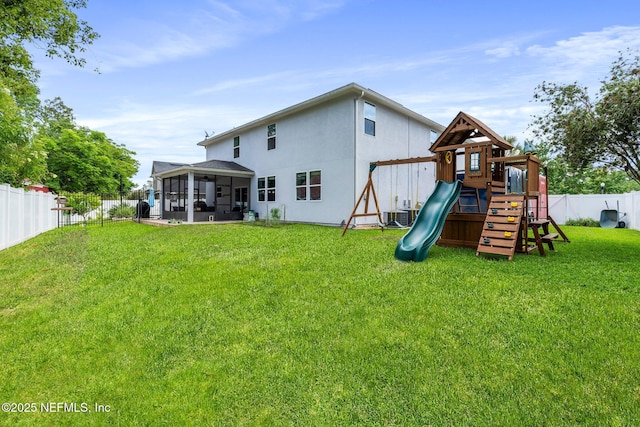 11725 Paddock Gates Dr, Jacksonville, FL 32223 - back of property featuring a sunroom, a playground, stucco siding, and cooling unit