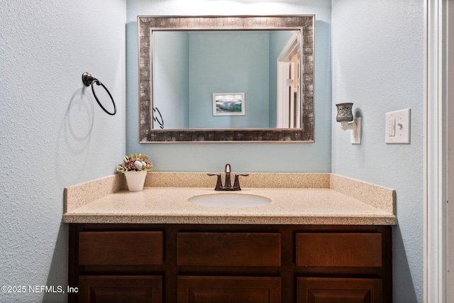 11725 Paddock Gates Dr, Jacksonville, FL 32223 - bathroom with vanity and a textured wall