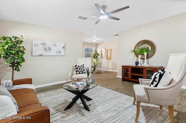 10625 Dodd Rd, Jacksonville, FL 32218 - living room featuring visible vents, ceiling fan, baseboards, and wood finished floors