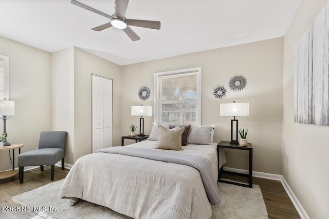 10625 Dodd Rd, Jacksonville, FL 32218 - bedroom with a closet, baseboards, a ceiling fan, and wood finished floors