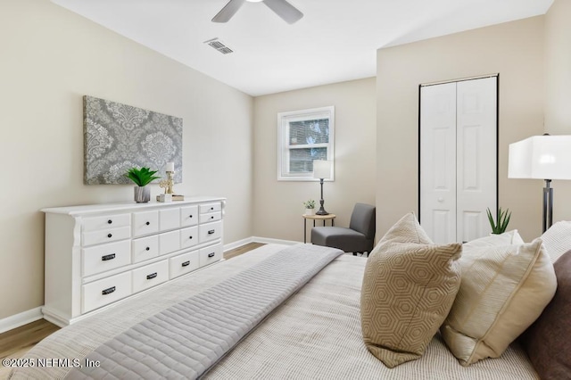 10625 Dodd Rd, Jacksonville, FL 32218 - bedroom featuring visible vents, baseboards, a closet, and wood finished floors