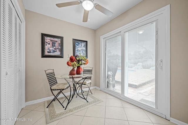 706 Montego Rd E, Jacksonville, FL 32216 - dining area featuring light tile patterned floors, baseboards, and a ceiling fan