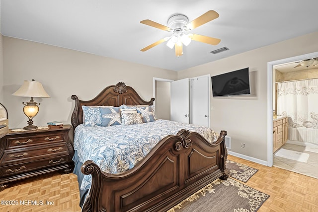 706 Montego Rd E, Jacksonville, FL 32216 - bedroom with baseboards, a ceiling fan, visible vents, and connected bathroom