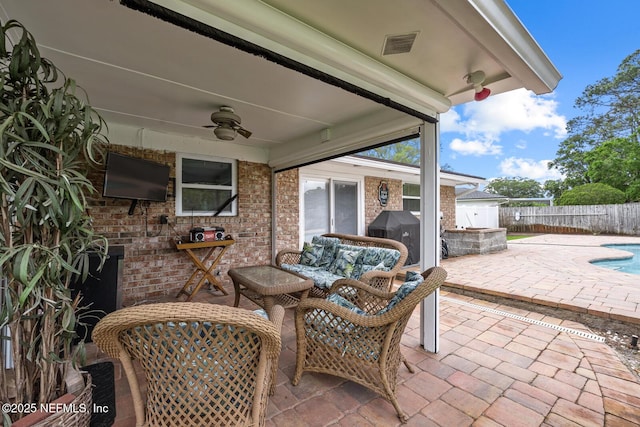706 Montego Rd E, Jacksonville, FL 32216 - view of patio featuring a ceiling fan, a fenced in pool, fence, and visible vents
