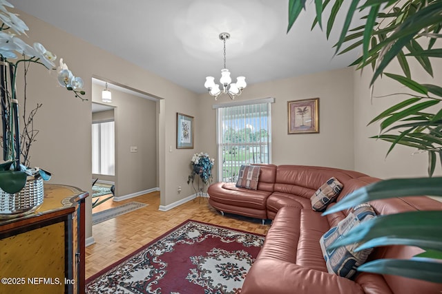 706 Montego Rd E, Jacksonville, FL 32216 - living room featuring an inviting chandelier and baseboards