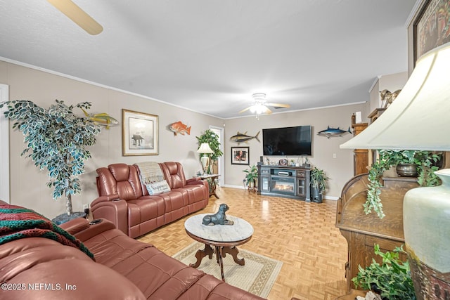 706 Montego Rd E, Jacksonville, FL 32216 - living area featuring a glass covered fireplace, baseboards, crown molding, and ceiling fan
