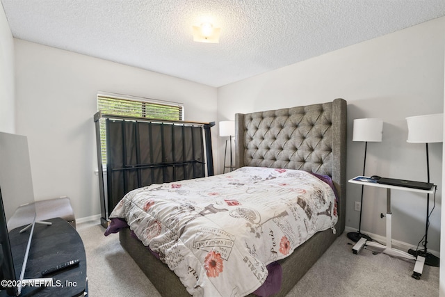 bedroom featuring baseboards, carpet flooring, and a textured ceiling