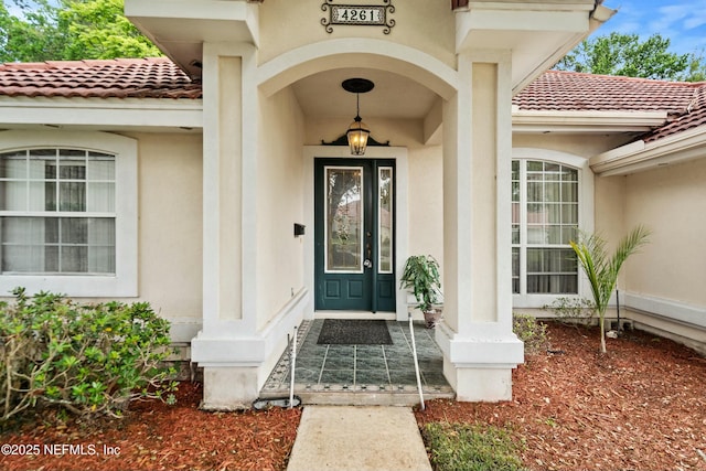 4261 Via Valencia Cir, Jacksonville, FL 32217 - entrance to property featuring stucco siding and a tile roof