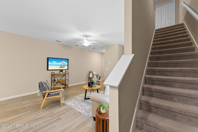 2627 Sandy Dune Dr, Jacksonville, FL 32233 - stairway with visible vents, baseboards, a ceiling fan, and wood finished floors
