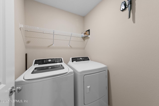 2627 Sandy Dune Dr, Jacksonville, FL 32233 - clothes washing area with washing machine and dryer and laundry area