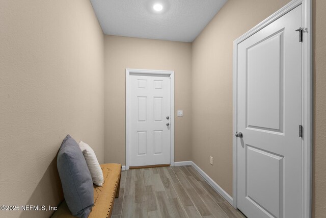 2627 Sandy Dune Dr, Jacksonville, FL 32233 - doorway featuring recessed lighting, light wood-style flooring, and baseboards