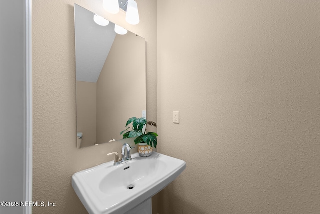 2627 Sandy Dune Dr, Jacksonville, FL 32233 - bathroom featuring a sink and a textured wall