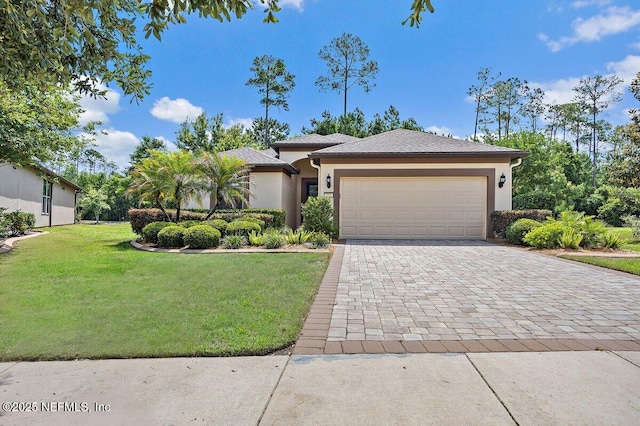 205 Clay Gully Trl, Ponte Vedra, FL 32081 - view of front of property with a front yard, stucco siding, a garage, and decorative driveway