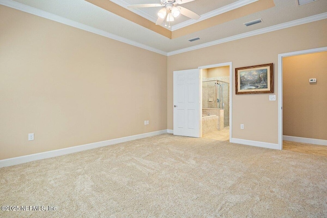205 Clay Gully Trl, Ponte Vedra, FL 32081 - unfurnished bedroom with a tray ceiling, crown molding, light colored carpet, and baseboards
