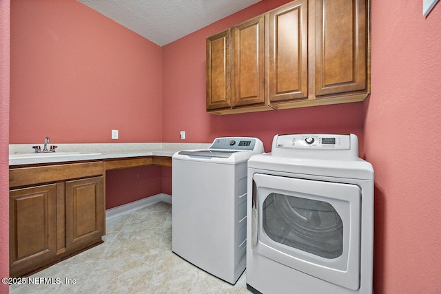 205 Clay Gully Trl, Ponte Vedra, FL 32081 - laundry area with cabinet space, washing machine and clothes dryer, a textured ceiling, light carpet, and baseboards