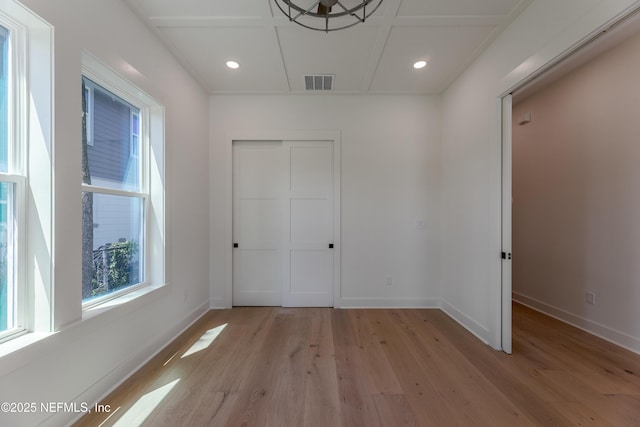 unfurnished bedroom featuring light wood-style flooring, a closet, visible vents, recessed lighting, and baseboards