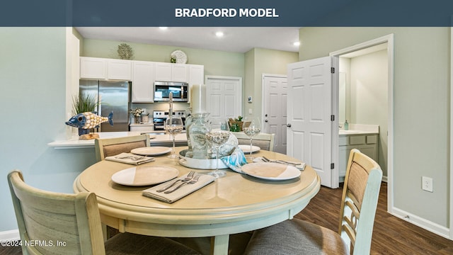 dining area with baseboards, dark wood-style floors, and recessed lighting