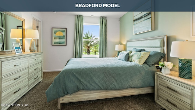 bedroom with dark colored carpet and baseboards