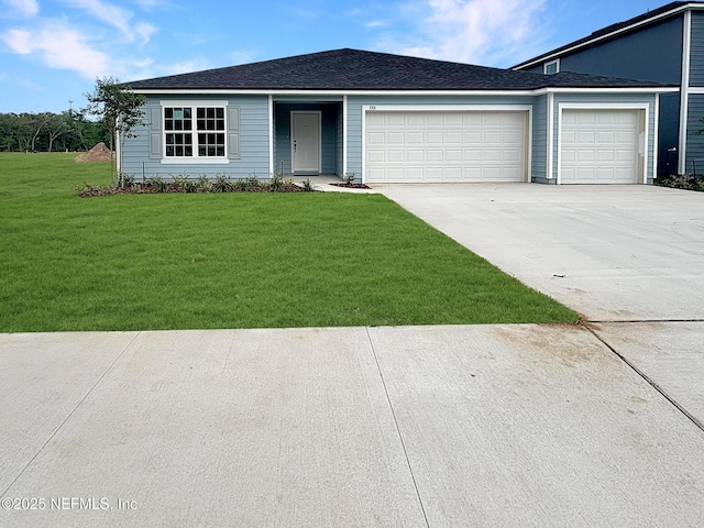 ranch-style home with a garage, a front yard, and concrete driveway
