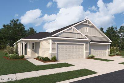 603 Juniper Hills Dr, Saint Johns, FL 32259 - craftsman house with board and batten siding, an attached garage, driveway, and a front lawn