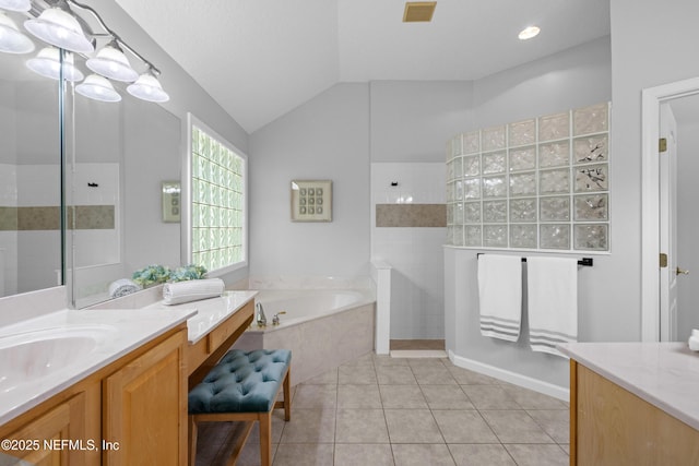 bathroom with vaulted ceiling, walk in shower, visible vents, and a garden tub