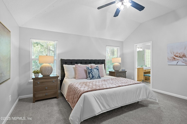 bedroom featuring vaulted ceiling, baseboards, carpet floors, and multiple windows