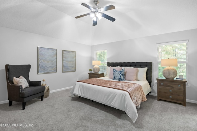 bedroom with baseboards, carpet, and multiple windows