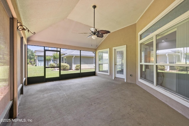 unfurnished sunroom with ceiling fan