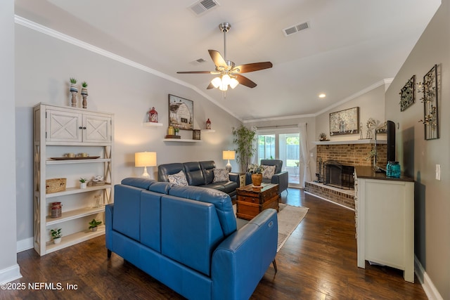 living room with a ceiling fan, crown molding, dark wood-style floors, and visible vents