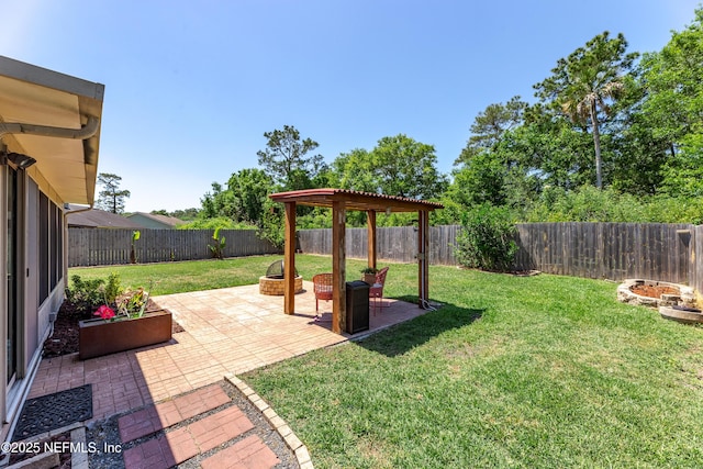 view of yard with a fenced backyard and a patio area