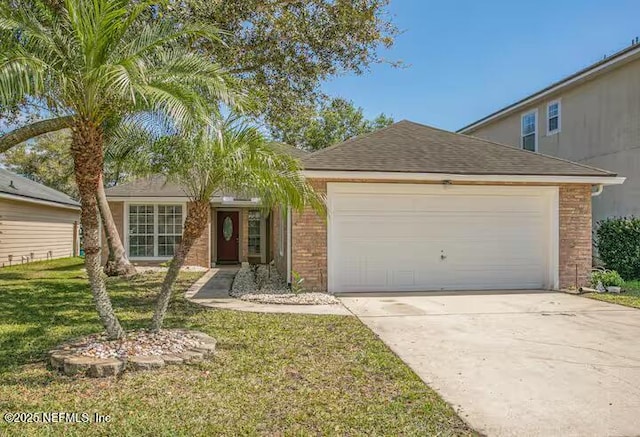 single story home with brick siding, an attached garage, driveway, and a front lawn