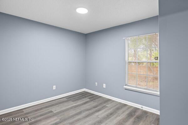 11978 Canterwood Dr, Jacksonville, FL 32246 - spare room with wood finished floors and baseboards