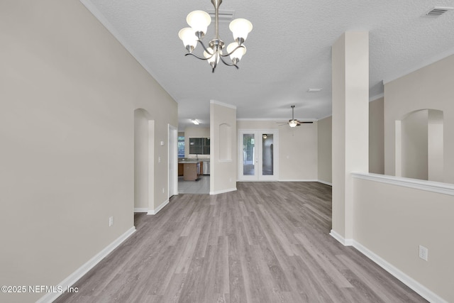 2395 Watermill Dr, Orange Park, FL 32073 - unfurnished living room with baseboards, a textured ceiling, visible vents, ceiling fan with notable chandelier, and wood finished floors