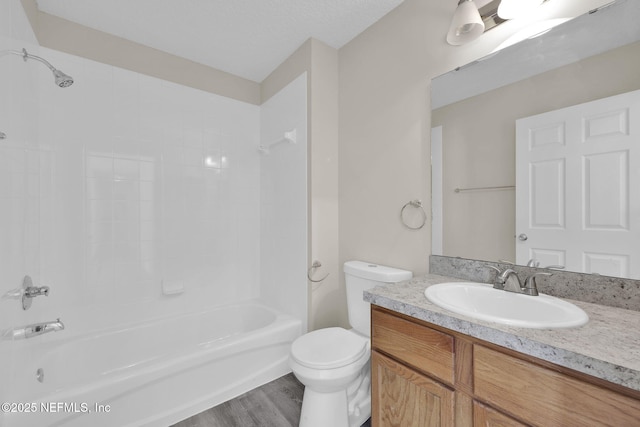 2395 Watermill Dr, Orange Park, FL 32073 - bathroom featuring toilet, shower / bath combination, wood finished floors, and vanity
