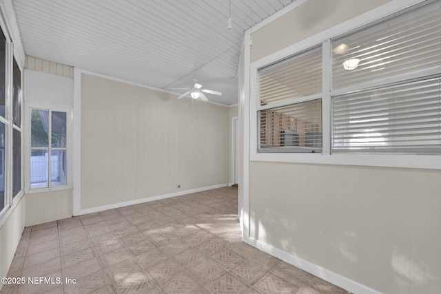 2395 Watermill Dr, Orange Park, FL 32073 - empty room featuring wood walls, baseboards, and ceiling fan