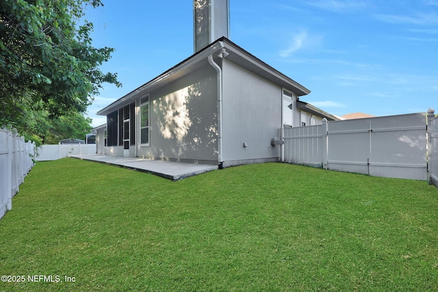 2395 Watermill Dr, Orange Park, FL 32073 - back of property with a patio area, a fenced backyard, and a lawn