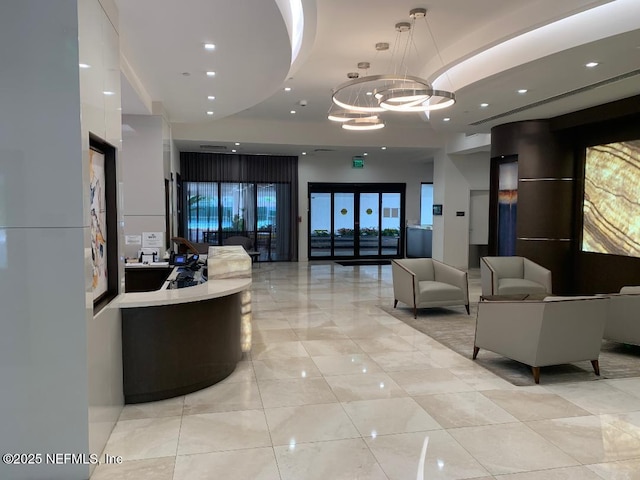 20225 NE 34th Ct Unit 817, Miami, FL 33810 - welcome area featuring an inviting chandelier