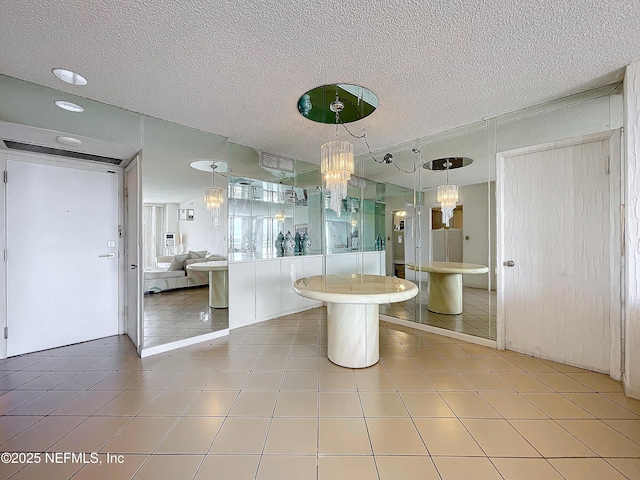 20225 NE 34th Ct Unit 817, Miami, FL 33810 - bathroom featuring tile patterned flooring, walk in shower, a chandelier, and a textured ceiling