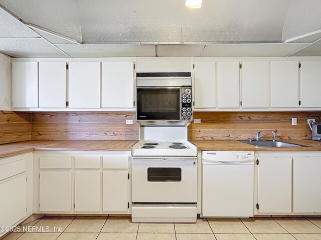 20225 NE 34th Ct Unit 817, Miami, FL 33810 - kitchen with a sink, light countertops, white appliances, and light tile patterned flooring