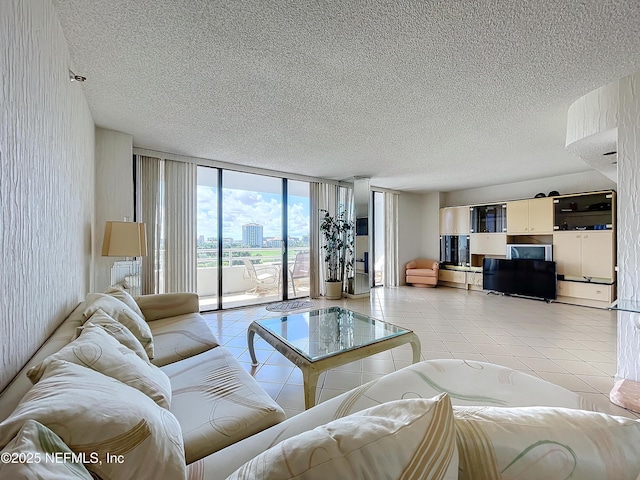 20225 NE 34th Ct Unit 817, Miami, FL 33810 - living room with a textured ceiling, light tile patterned flooring, and expansive windows